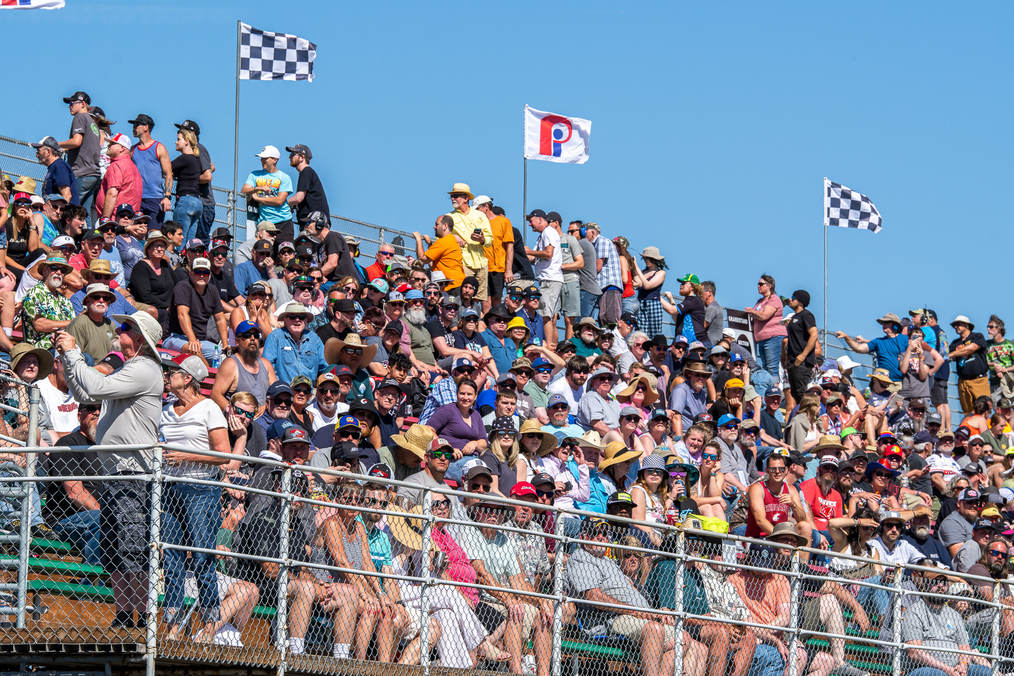 A busy crowd fills the event site