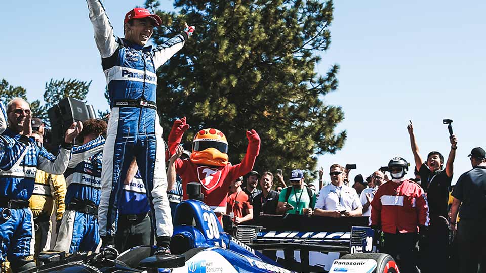 Takuma Sato celebrates his win in Portland